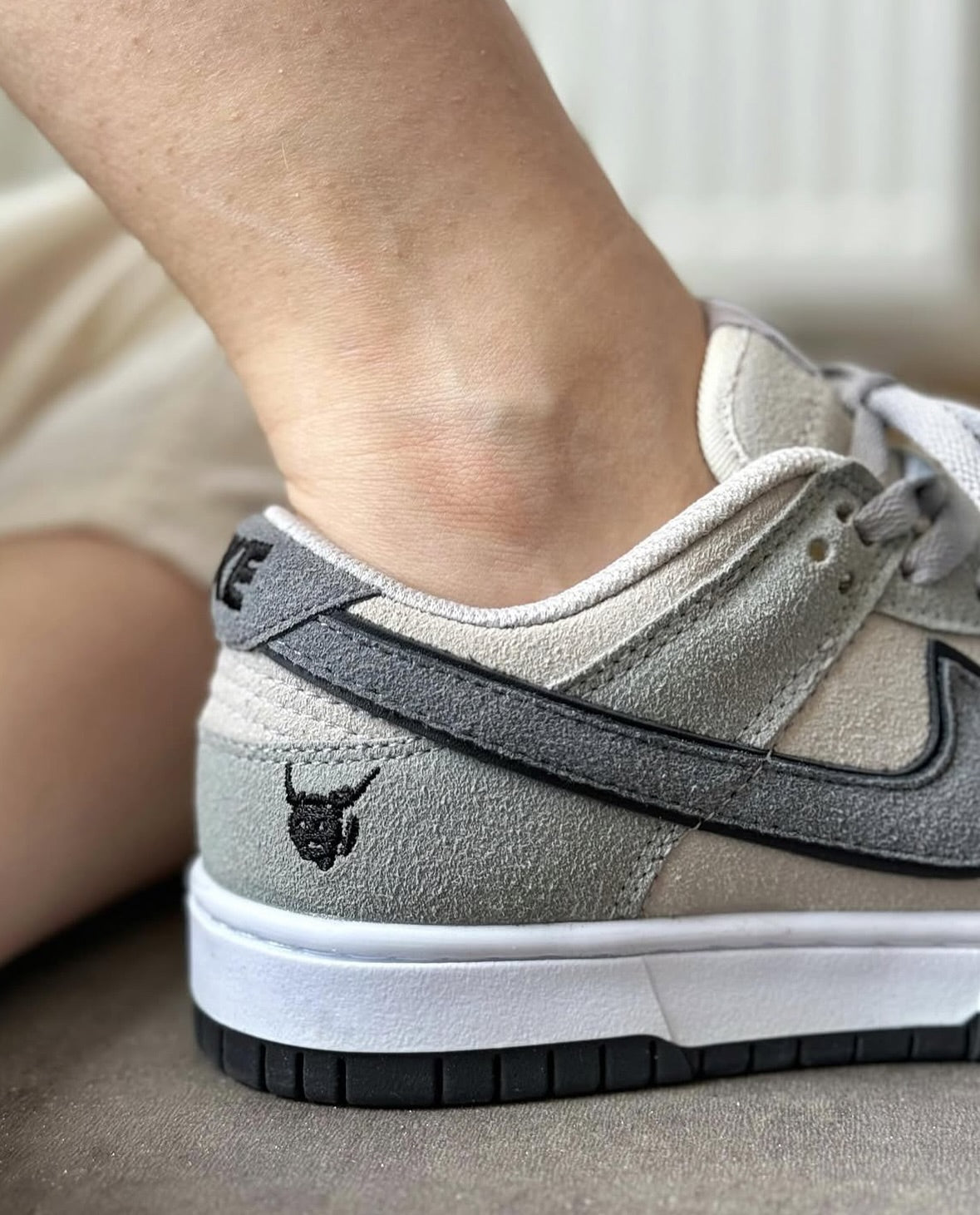 The Nike Dunk Low in light grey