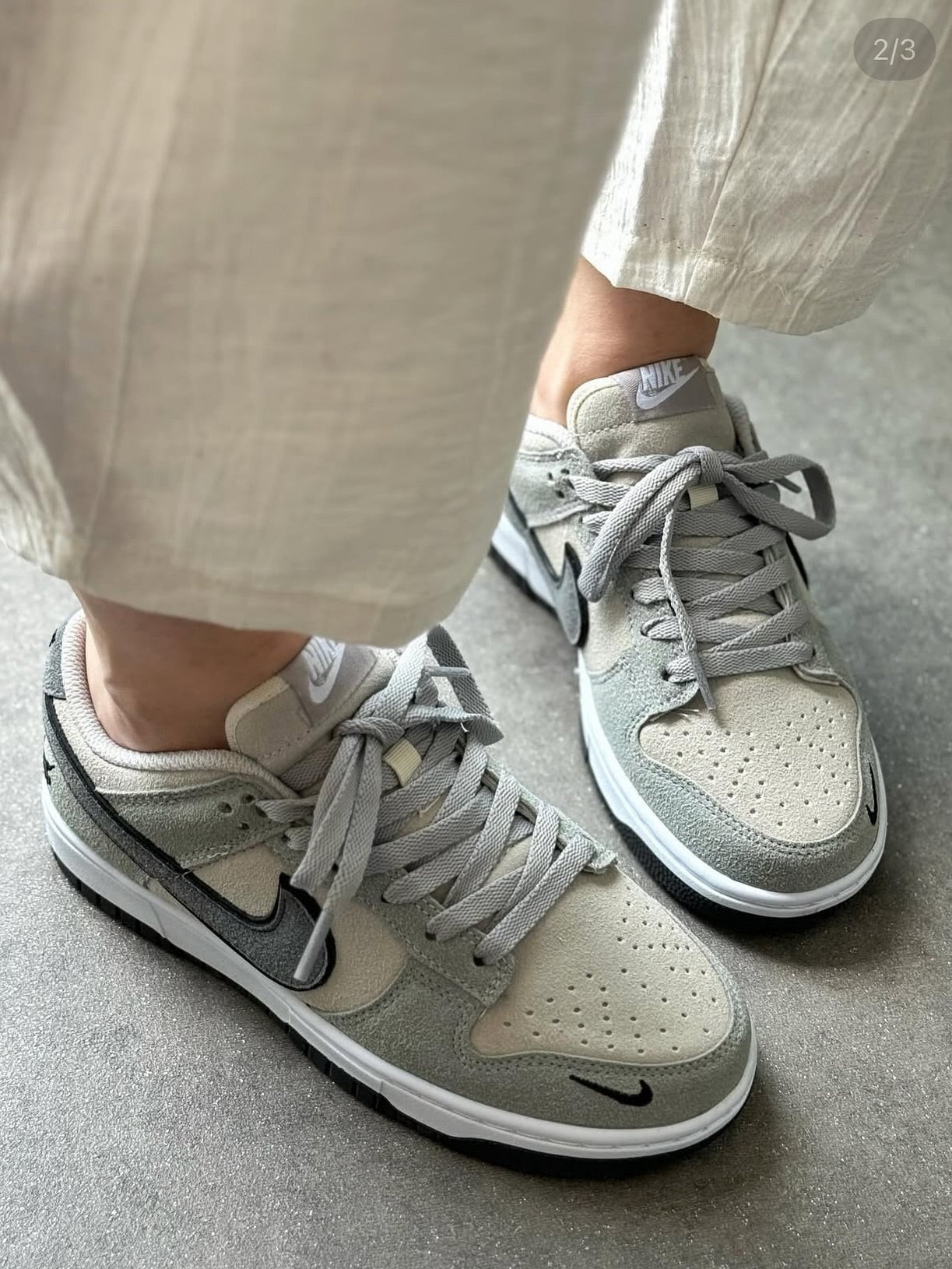 The Nike Dunk Low in light grey