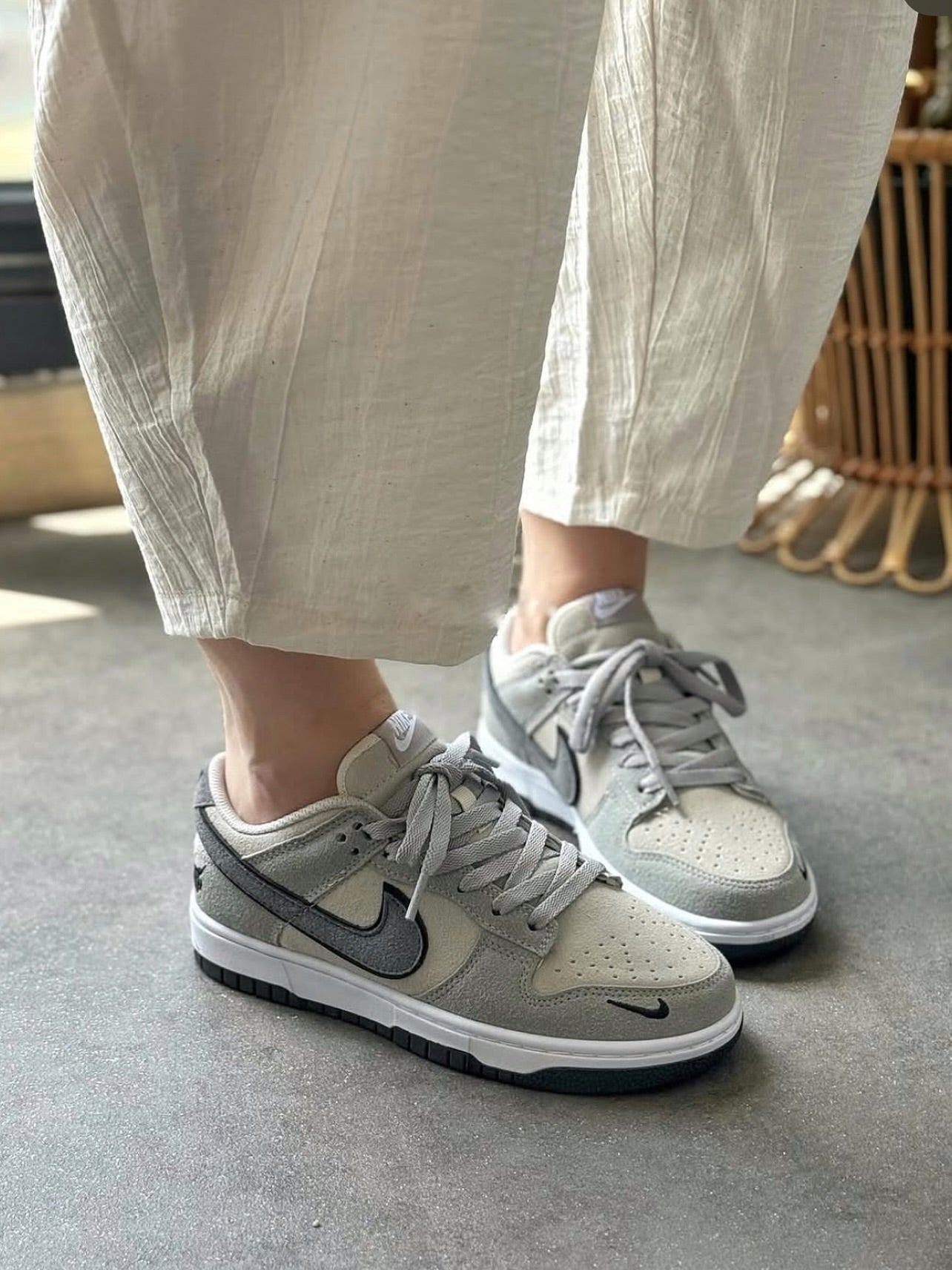 The Nike Dunk Low in light grey