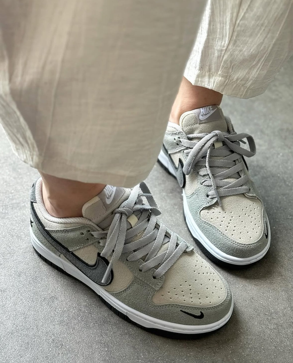 The Nike Dunk Low in light grey
