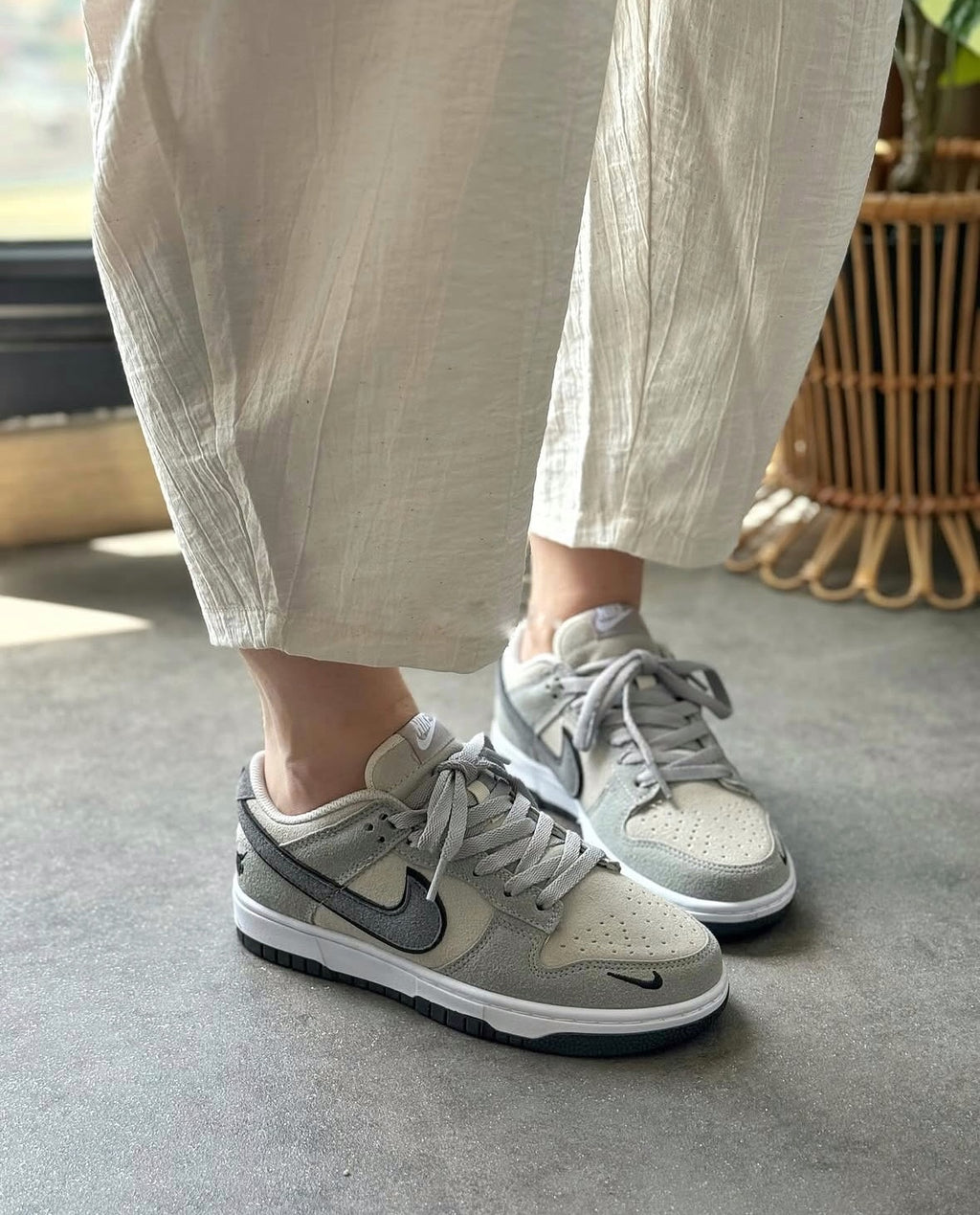 The Nike Dunk Low in light grey